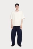 7115 By Szeki | Relaxed Curve Legged Trouser In Navy - SHOP YUCCA Pants 7115 BY SZEKI - YUCCA, Women’s clothing store Denver, women’s clothing website, women’s elevated pants, clothing boutiques near me, women’s elevated trousers.