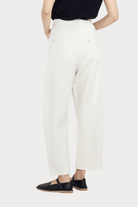 7115 By Szeki | Relaxed Curve Legged Trouser In Off-White - SHOP YUCCA Pants 7115 BY SZEKI - YUCCA, Women’s clothing store Denver, women’s clothing website, women’s elevated pants, clothing boutiques near me, women’s elevated trousers.