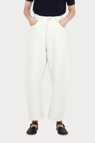 7115 By Szeki | Relaxed Curve Legged Trouser In Off-White - SHOP YUCCA Pants 7115 BY SZEKI - YUCCA, Women’s clothing store Denver, women’s clothing website, women’s elevated pants, clothing boutiques near me, women’s elevated trousers.