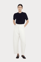 7115 By Szeki | Relaxed Curve Legged Trouser In Off-White - SHOP YUCCA Pants 7115 BY SZEKI - YUCCA, Women’s clothing store Denver, women’s clothing website, women’s elevated pants, clothing boutiques near me, women’s elevated trousers.