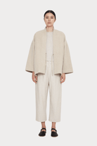 7115 By Szeki | Reversible Quilted Jacket In Oatmeal - SHOP YUCCA Coats & Jackets 7115 BY SZEKI - YUCCA, Women’s clothing store Denver, women’s clothing website, women’s high quality jackets, women’s high quality coats, women’s high quality outerwear.