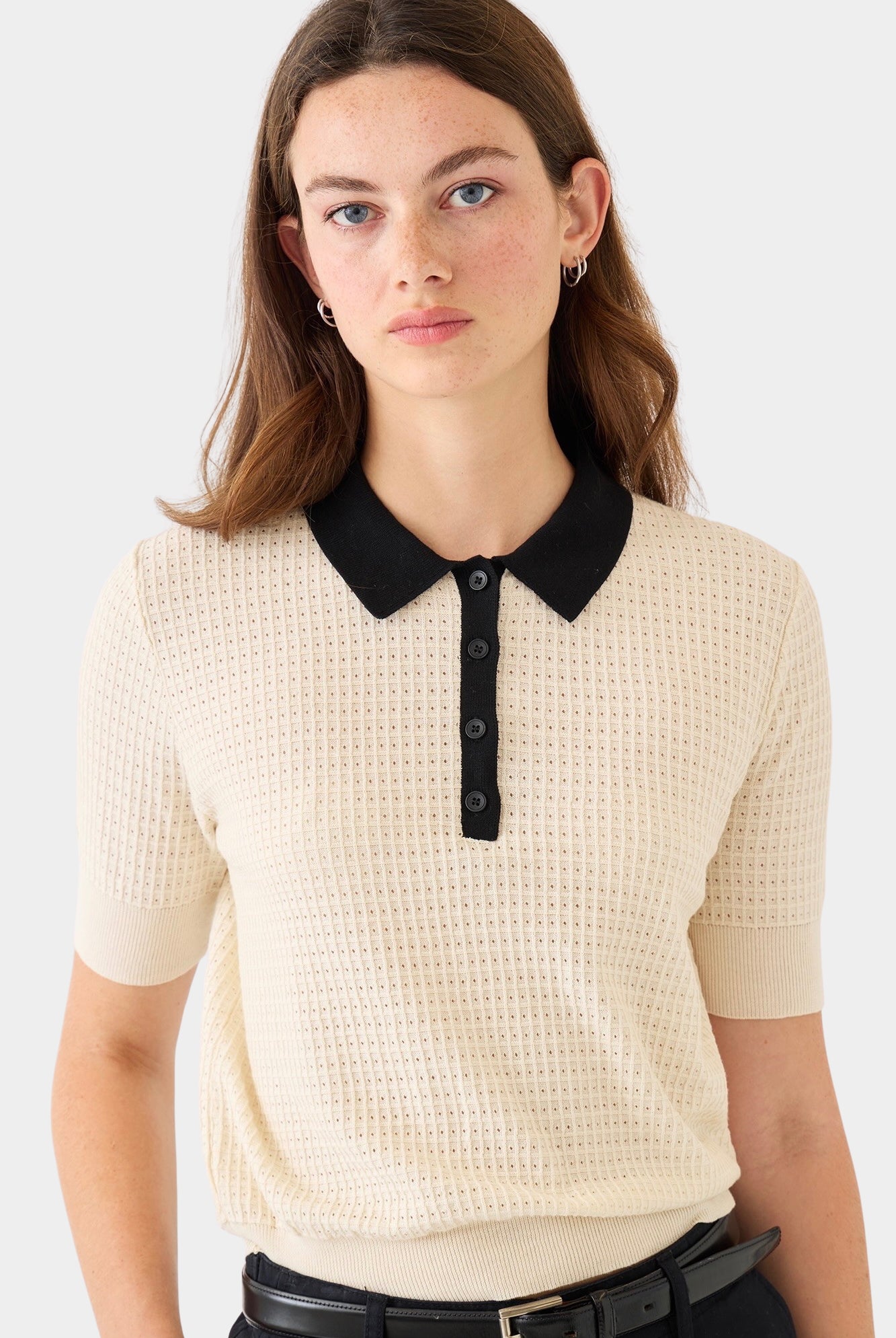 DEMYLEE Celia waffle pointelle cotton polo knit top in ecru with black collar worn on model