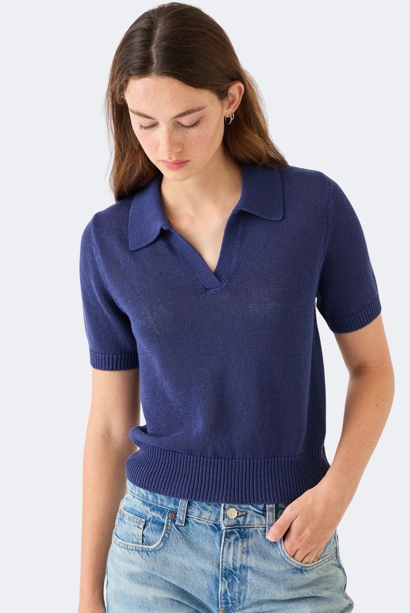 Front view of DEMYLEE Cris indigo cotton linen polo sweater styled with denim