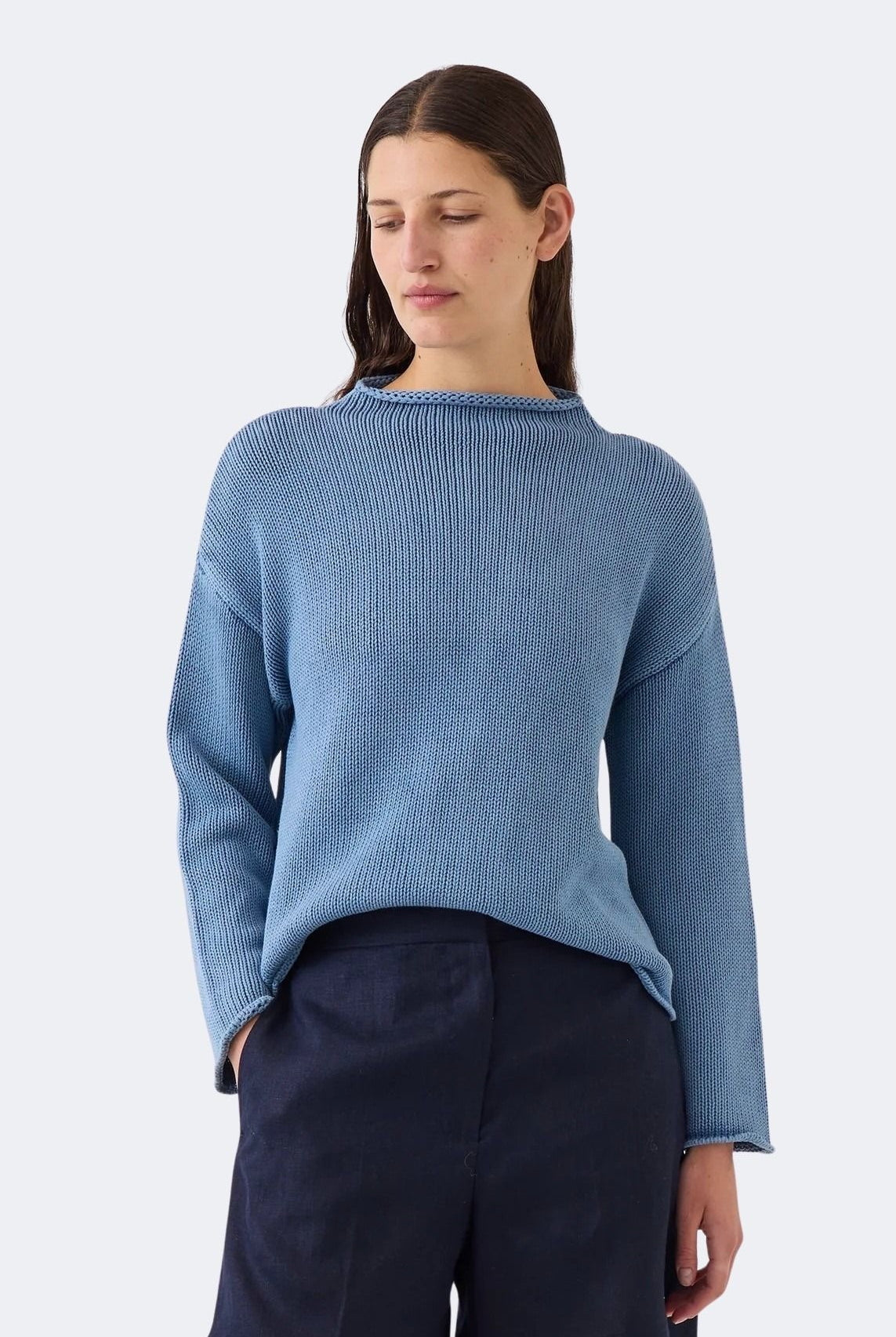 Model wearing DEMYLEE Lamis denim washed cotton sweater with dropped shoulders and relaxed silhouette