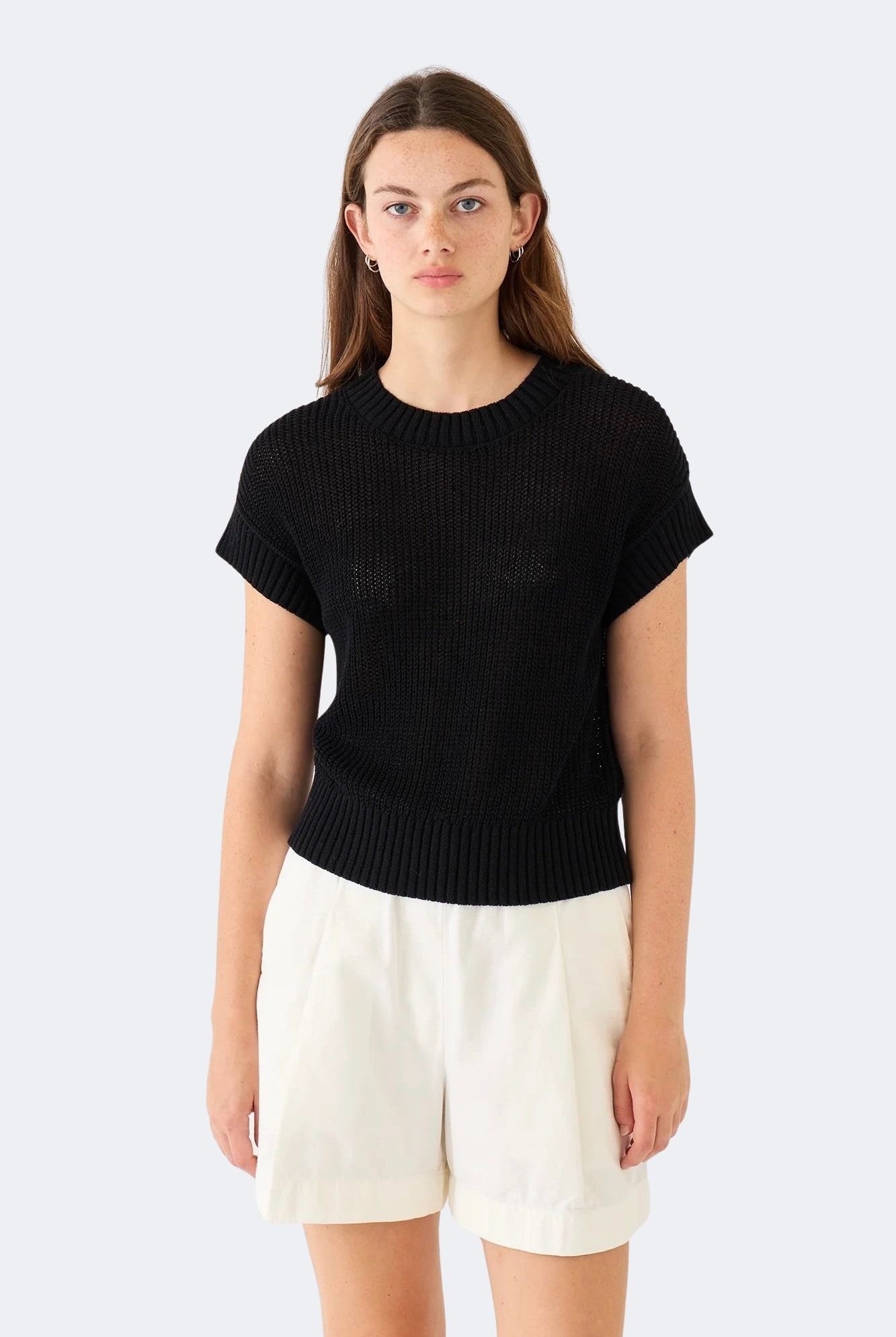 Model wearing DEMYLEE Marlowe black cotton linen knit top with relaxed silhouette and ribbed trim
