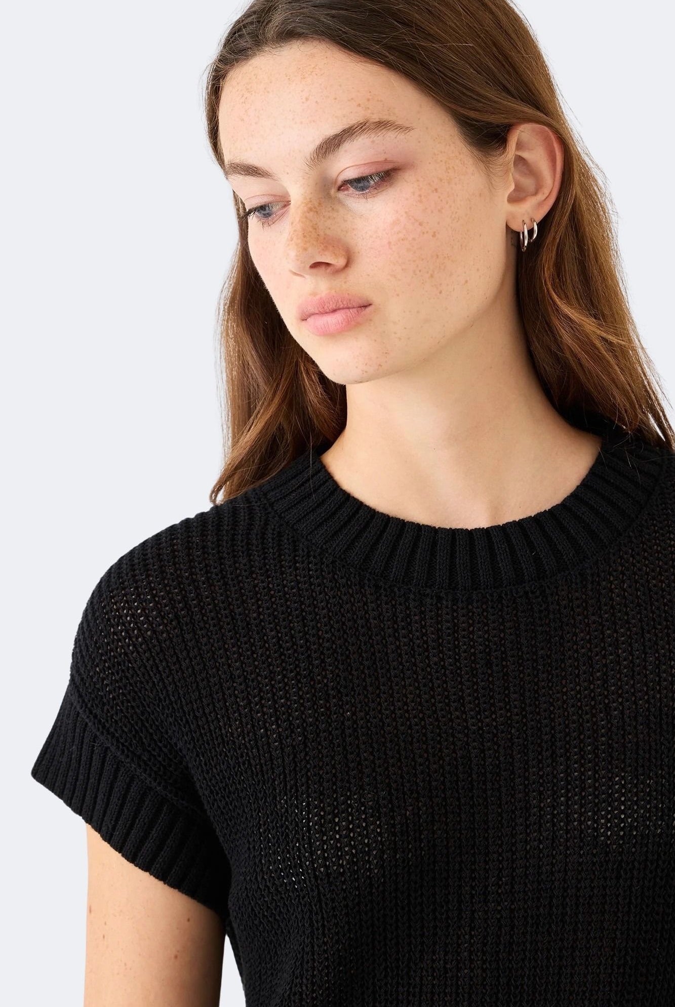 Close view of DEMYLEE Marlowe black cotton linen open weave knit top highlighting textured stitch pattern