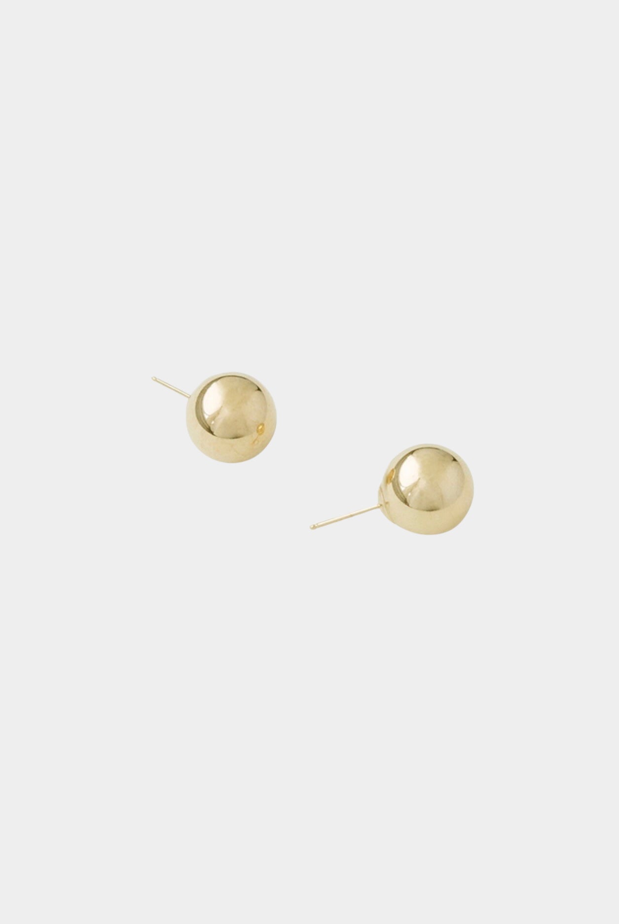 Medium polished gold sphere stud earrings with post backing.