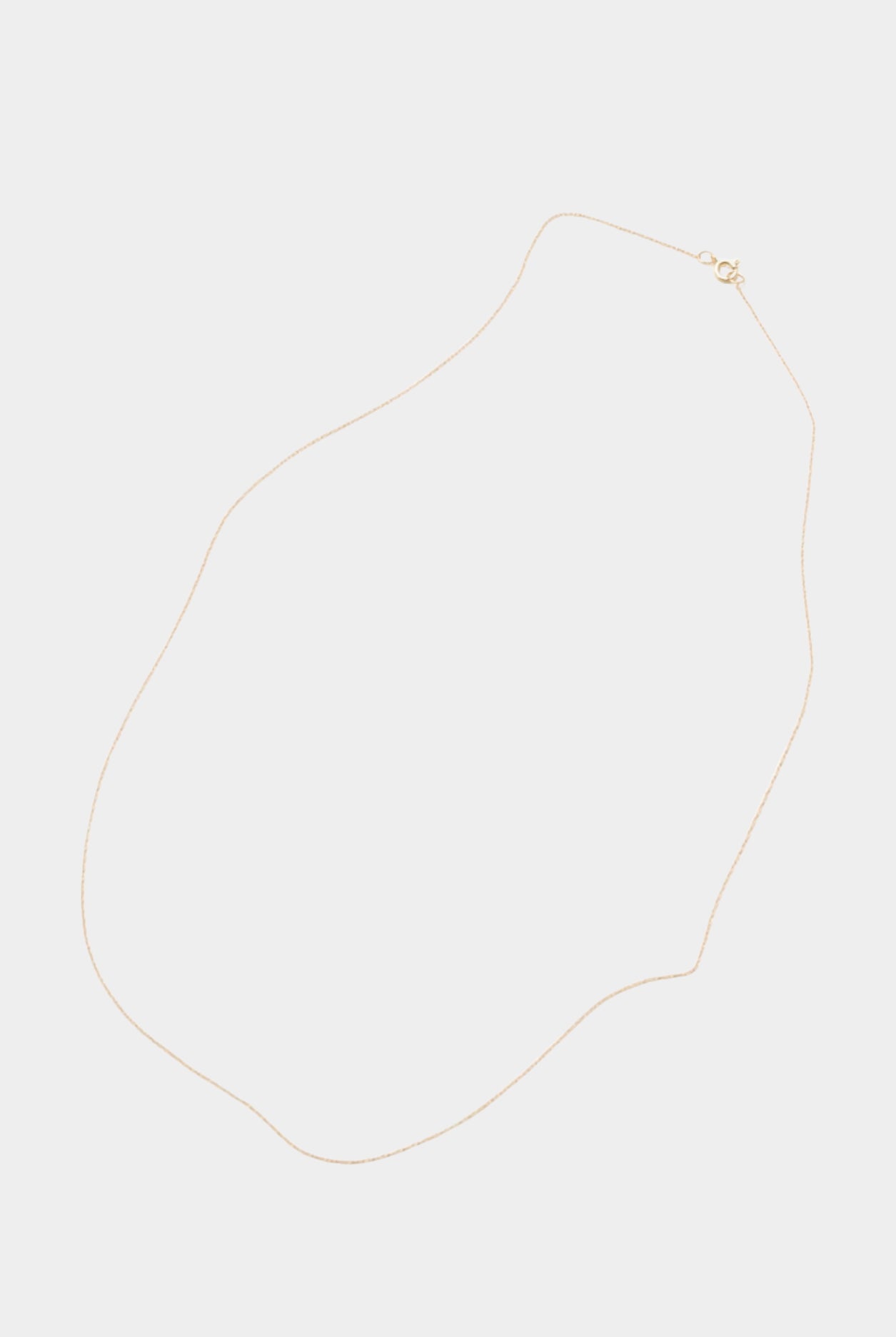 Minimalist 14k gold-filled chain necklace laid flat on neutral background.