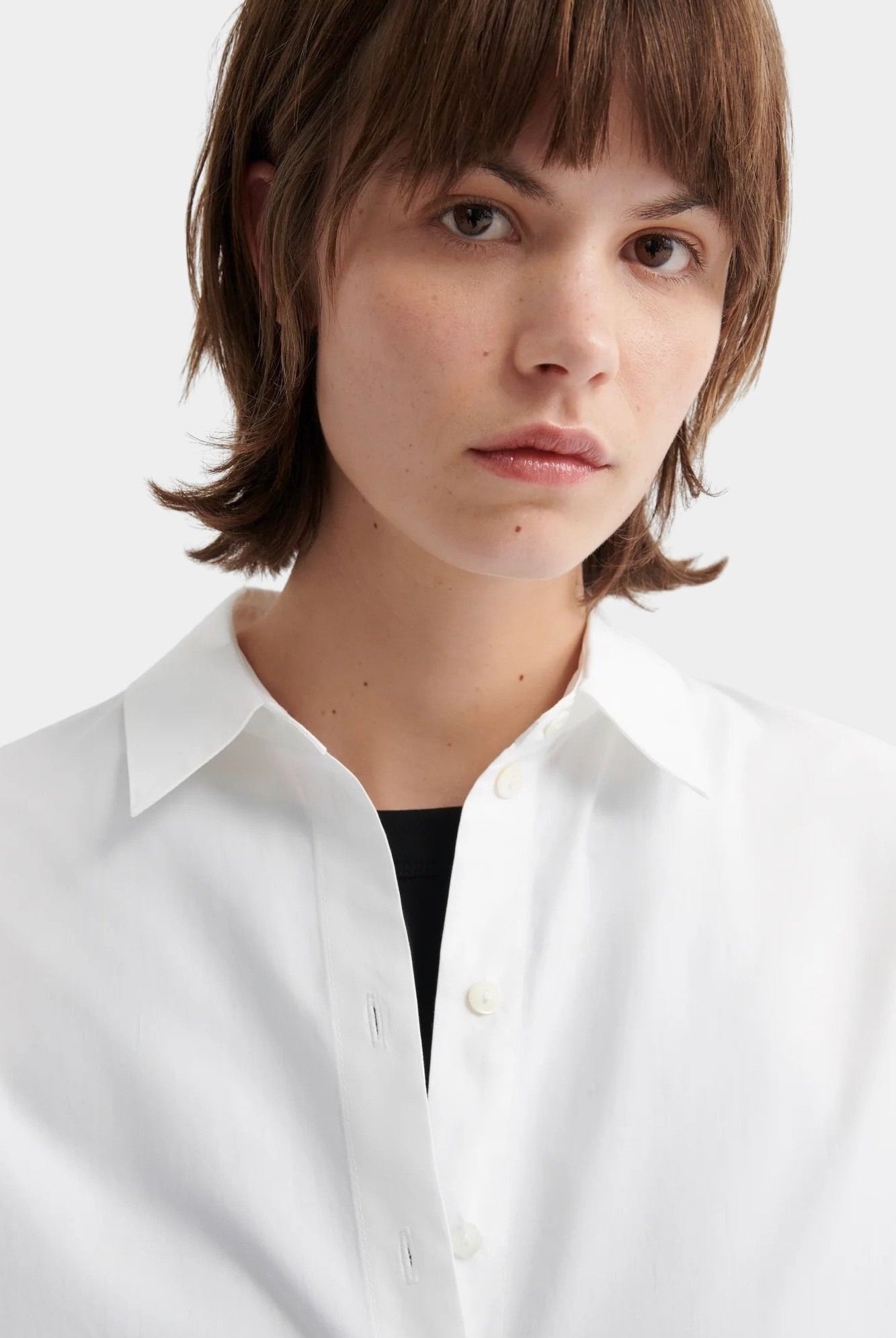 Kowtow Daily Shirt in white close up showing collar and button front detail