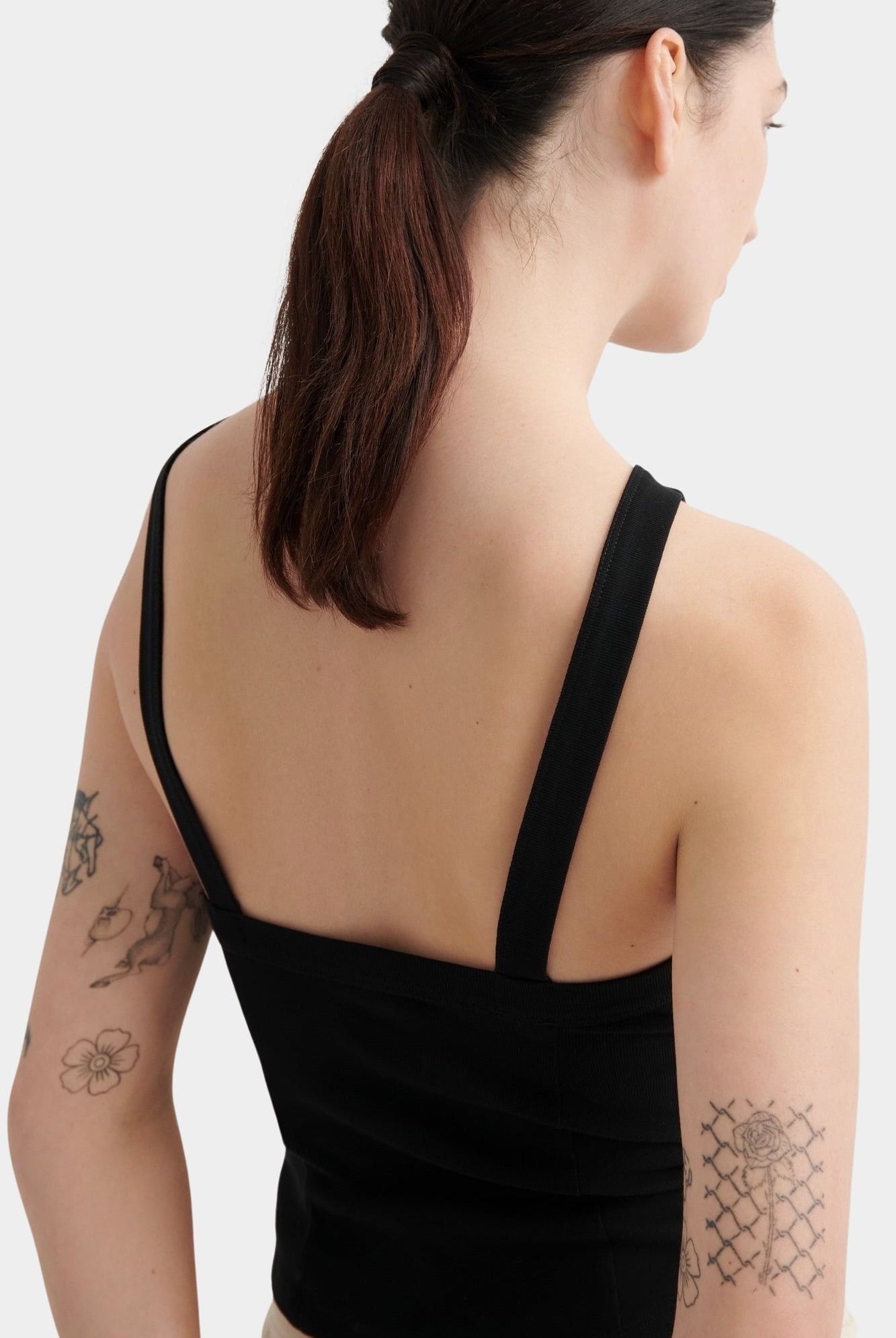 Kowtow Low Back Tank in black, close back view showing low square back and wide straps