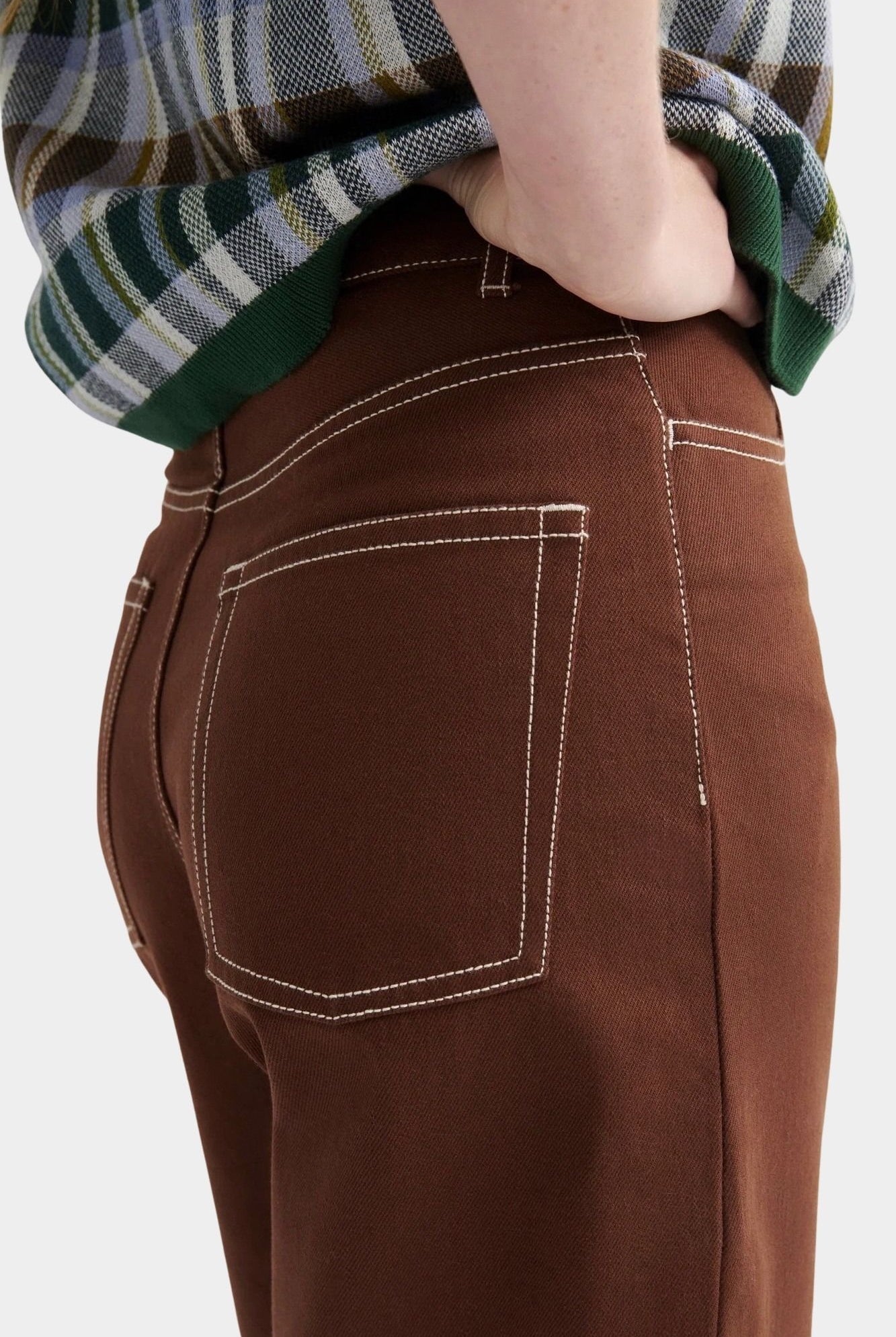 Kowtow Unity Jeans in brown denim close up back pocket detail with contrast stitching