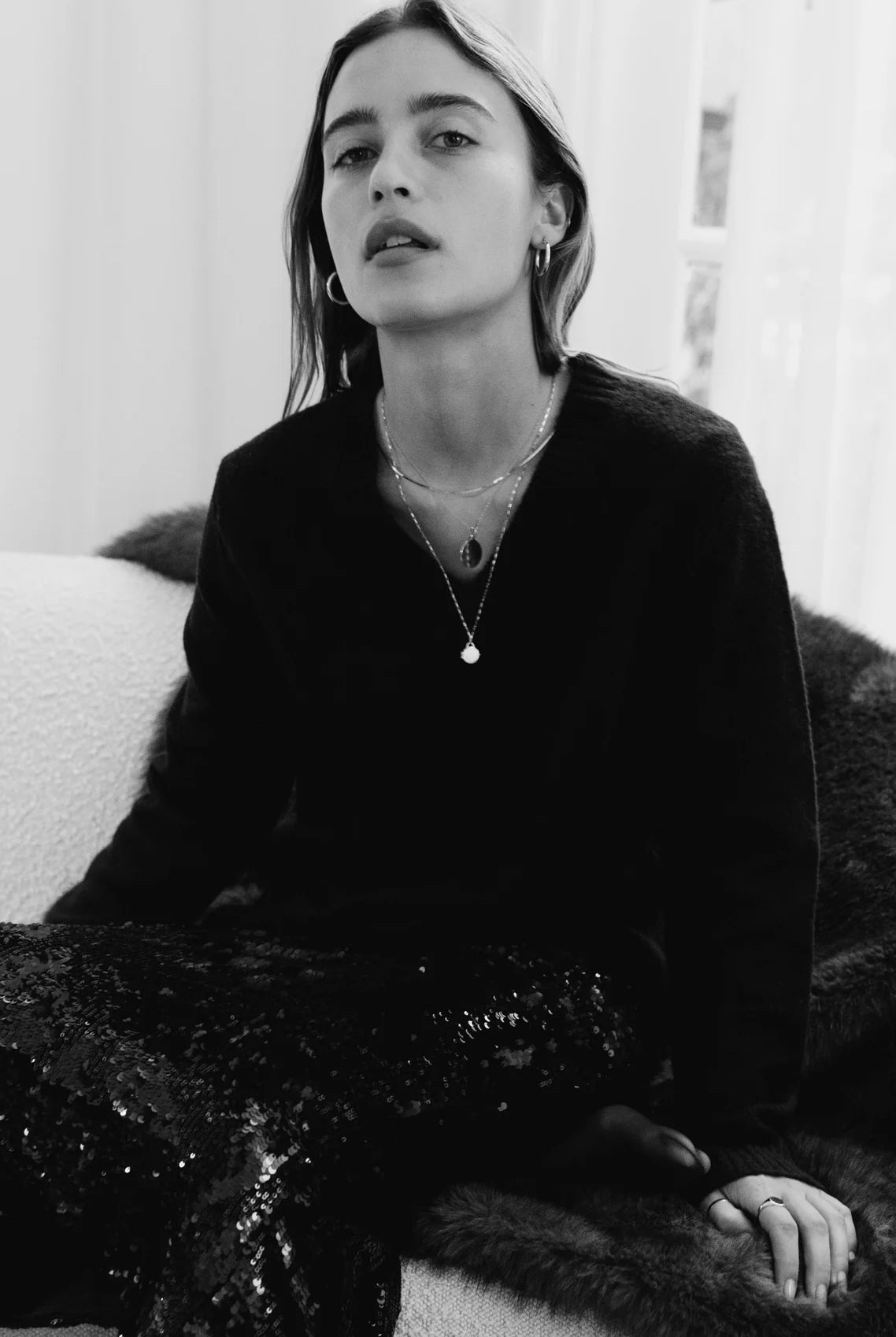 Model wearing 10K gold herringbone chain necklace.