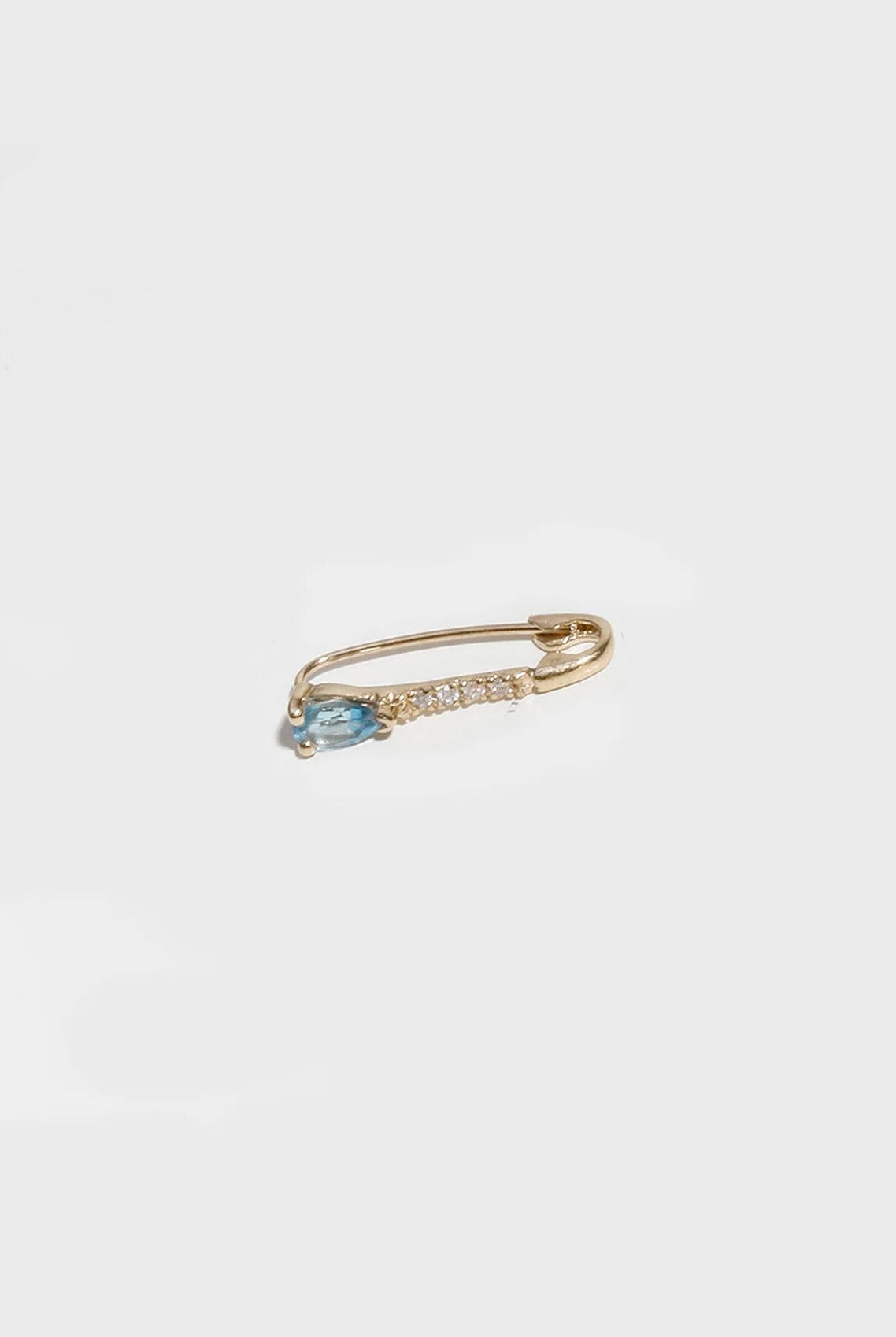 14K gold hoop earring with blue topaz drop and secure clasp closure.