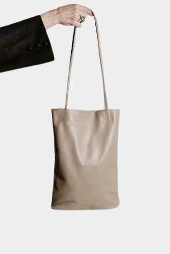 Modern Weaving | Slim Elongated Tote In Taupe - SHOP YUCCA Handbags MODERN WEAVING - YUCCA, Women’s clothing store Denver, women’s high quality bags, women’s online leather bags, minimalist leather bags.