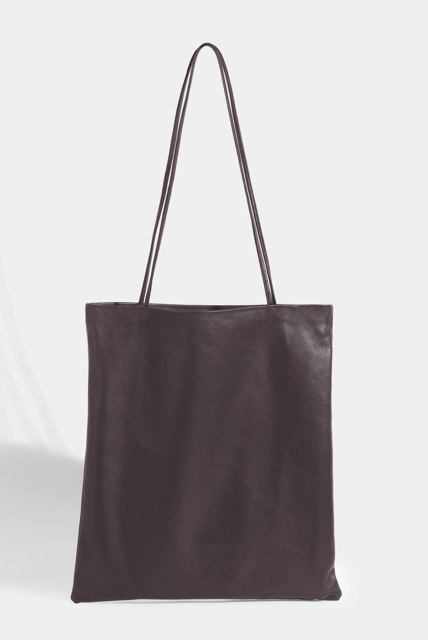 Modern Weaving | Slim Lamb Sak In Braun - SHOP YUCCA Handbags MODERN WEAVING - YUCCA, Women’s clothing store Denver, women’s high quality bags, women’s online leather bags, minimalist leather bags.