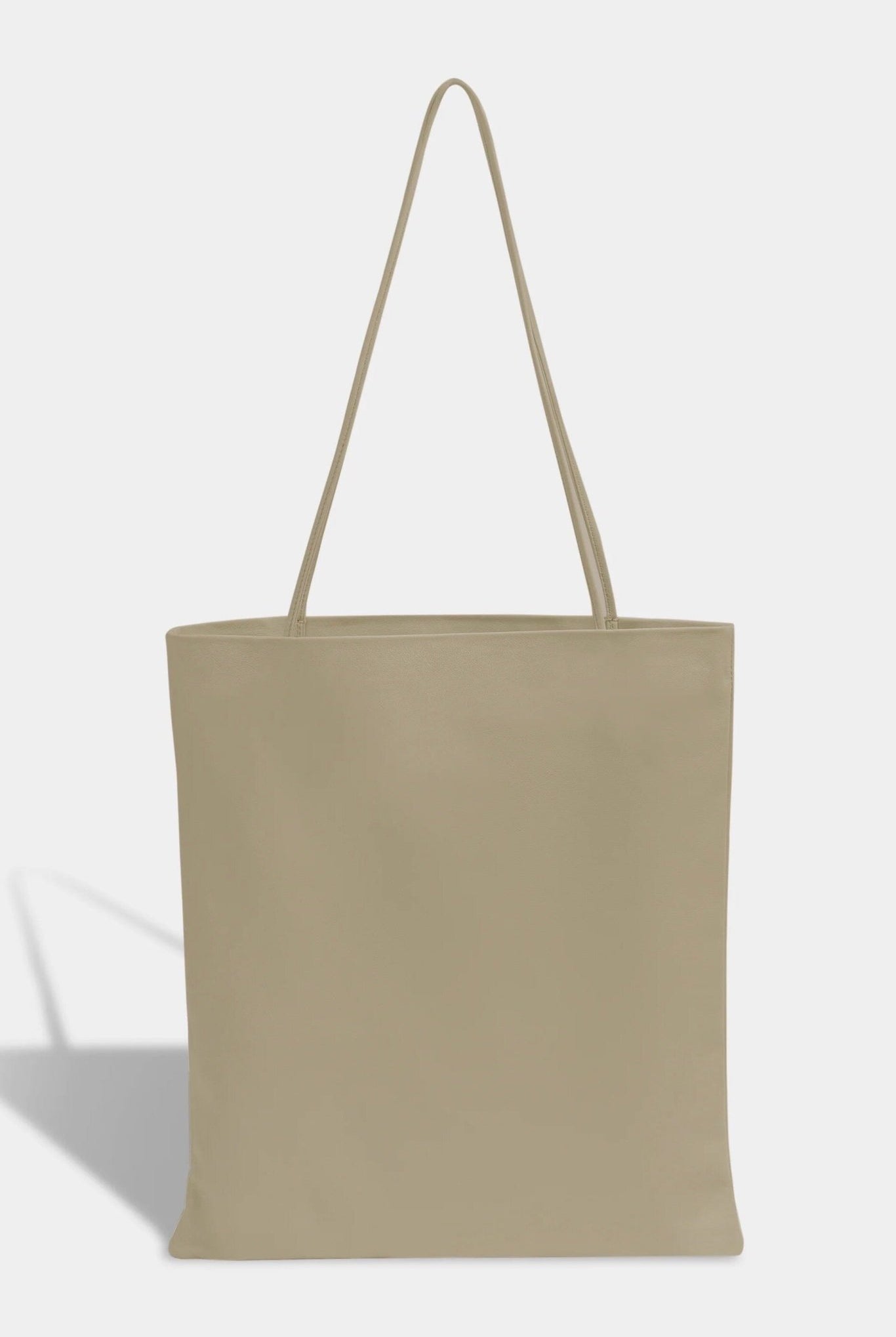 Modern Weaving | Slim Lamb Sak In Taupe - SHOP YUCCA Handbags MODERN WEAVING - YUCCA, Women’s clothing store Denver, women’s high quality bags, women’s online leather bags, minimalist leather bags.