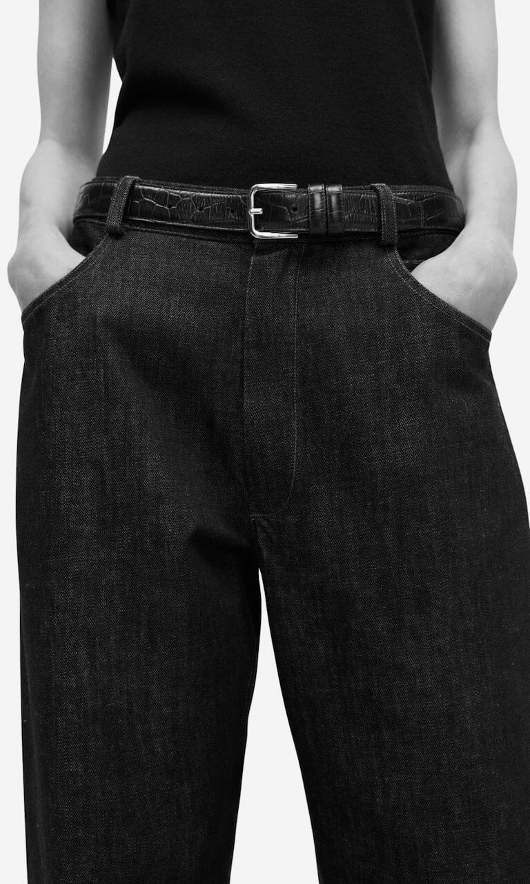 Minimal leather belt styled with high-waisted denim, modern women’s belt collection at YUCCA Denver