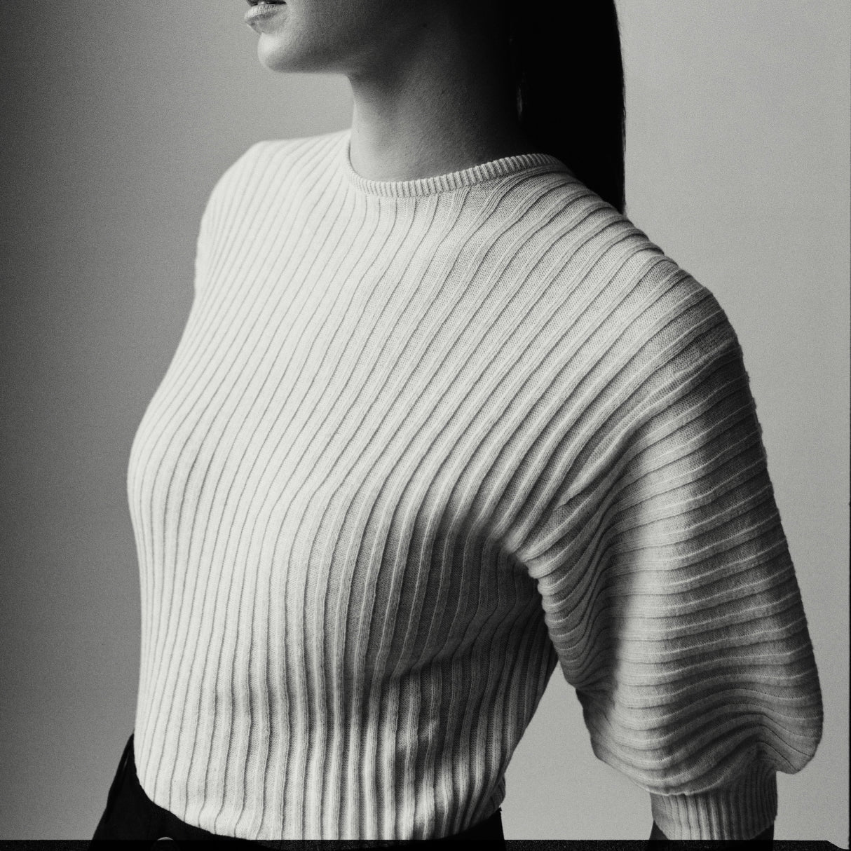 Kowtow sustainable organic cottonKowtow ribbed organic cotton knit top in neutral tone with sculptural silhouette