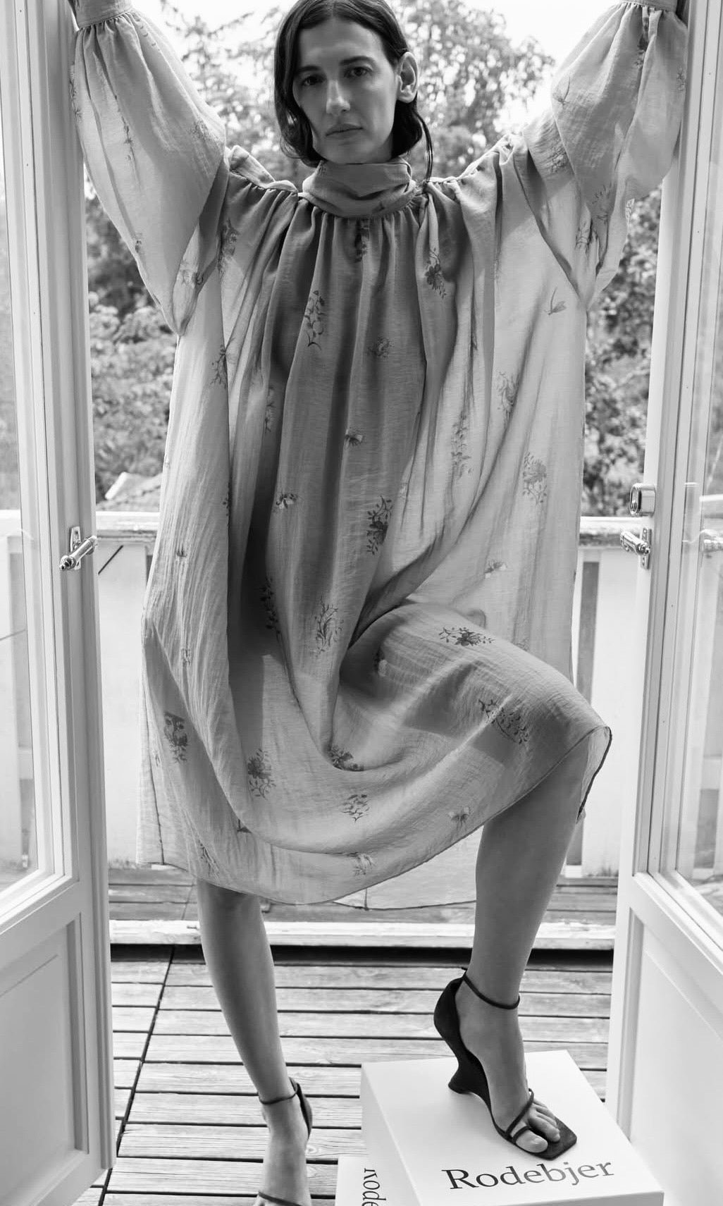 Rodebjer draped dress with relaxed silhouette and soft volume, worn by model in an airy interior setting, women’s designer clothing at YUCCA Denver