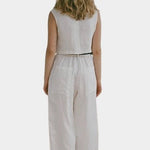 Shaina Mote Paradis trouser in natural organic cotton, rear full length with relaxed straight leg and cropped hem