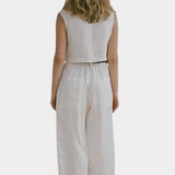 Shaina Mote Paradis trouser in natural organic cotton, rear full length with relaxed straight leg and cropped hem