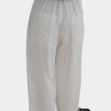 Shaina Mote Paradis trouser in natural organic cotton, back view showing elastic waistband and patch pockets