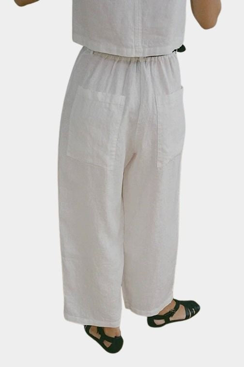 Shaina Mote Paradis trouser in natural organic cotton, back view showing elastic waistband and patch pockets
