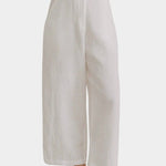 Shaina Mote Paradis trouser in natural organic cotton close-up of front with flat waistband, zipper fly and relaxed leg