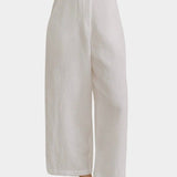 Shaina Mote Paradis trouser in natural organic cotton close-up of front with flat waistband, zipper fly and relaxed leg