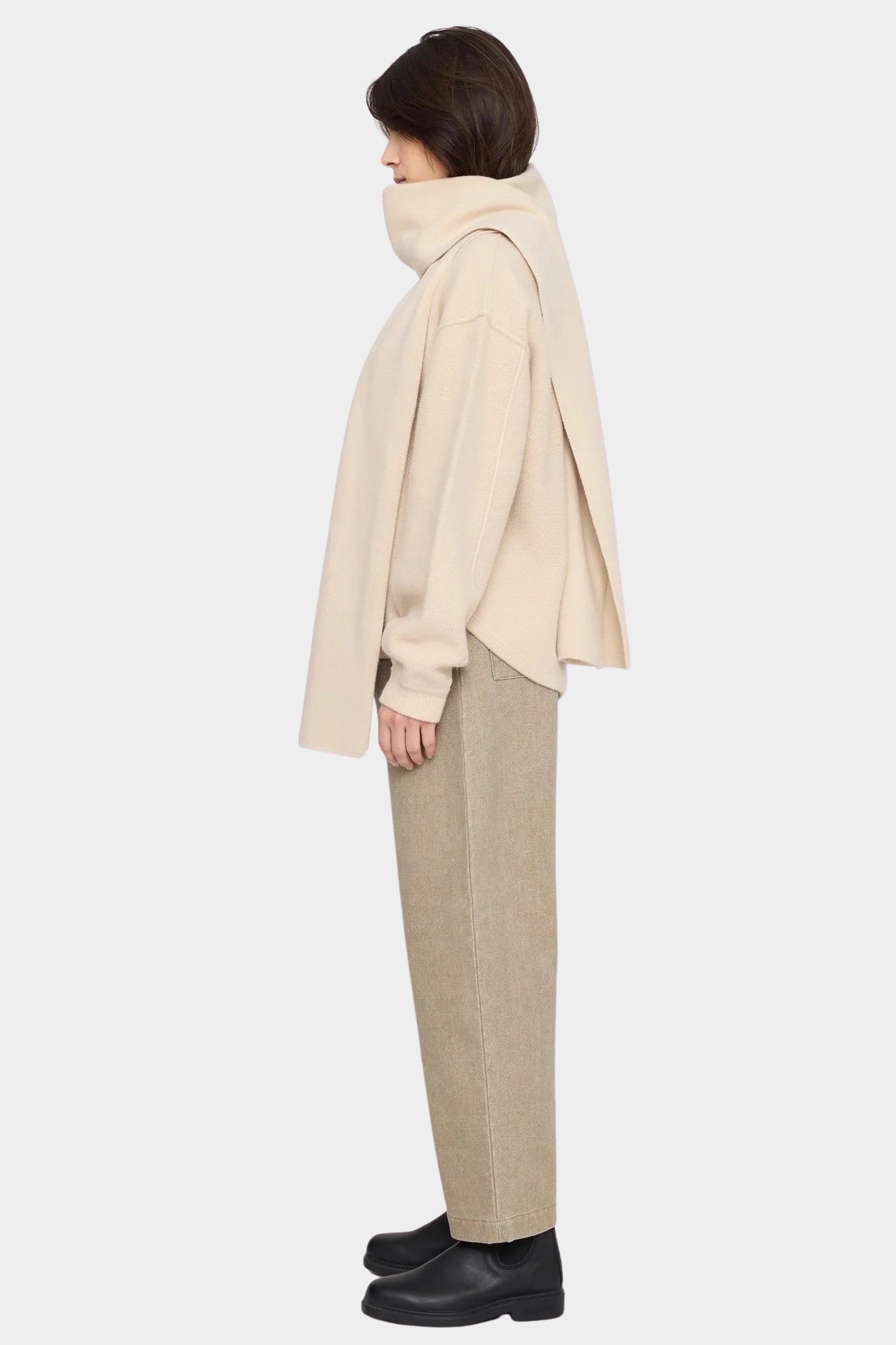 Side view of the off-white Long Wool Scarf wrapped around the neck with long ends draped front and back