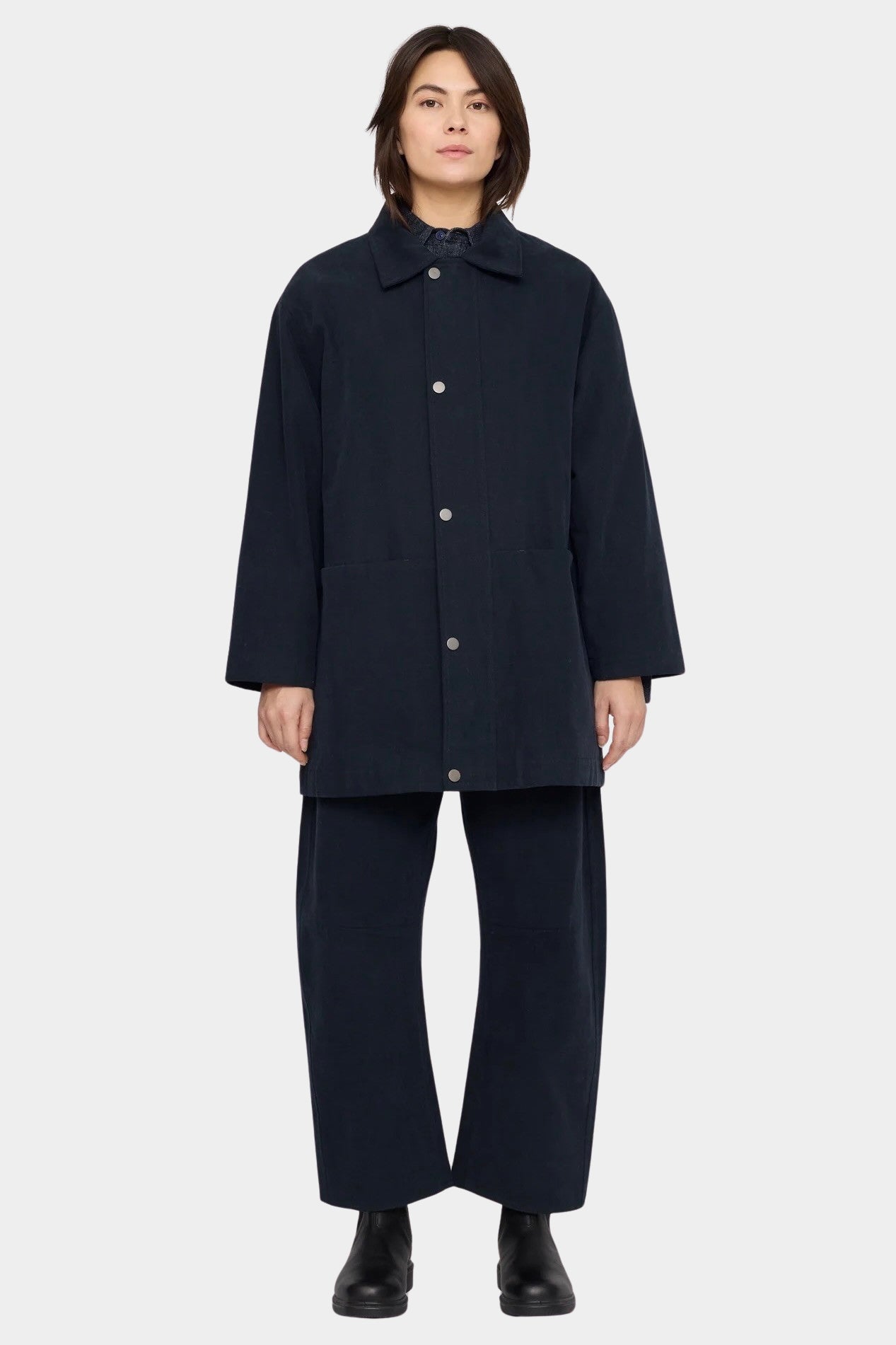 7115 by Szeki Mid-Length Chore Coat Navy front view fastened with snap buttons.