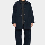 7115 by Szeki Mid-Length Chore Coat Navy front view worn open over a shirt at YUCCA Denver.