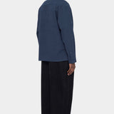 Back view of the navy Relaxed Pocket Shirt showing the dropped shoulders and straight hem