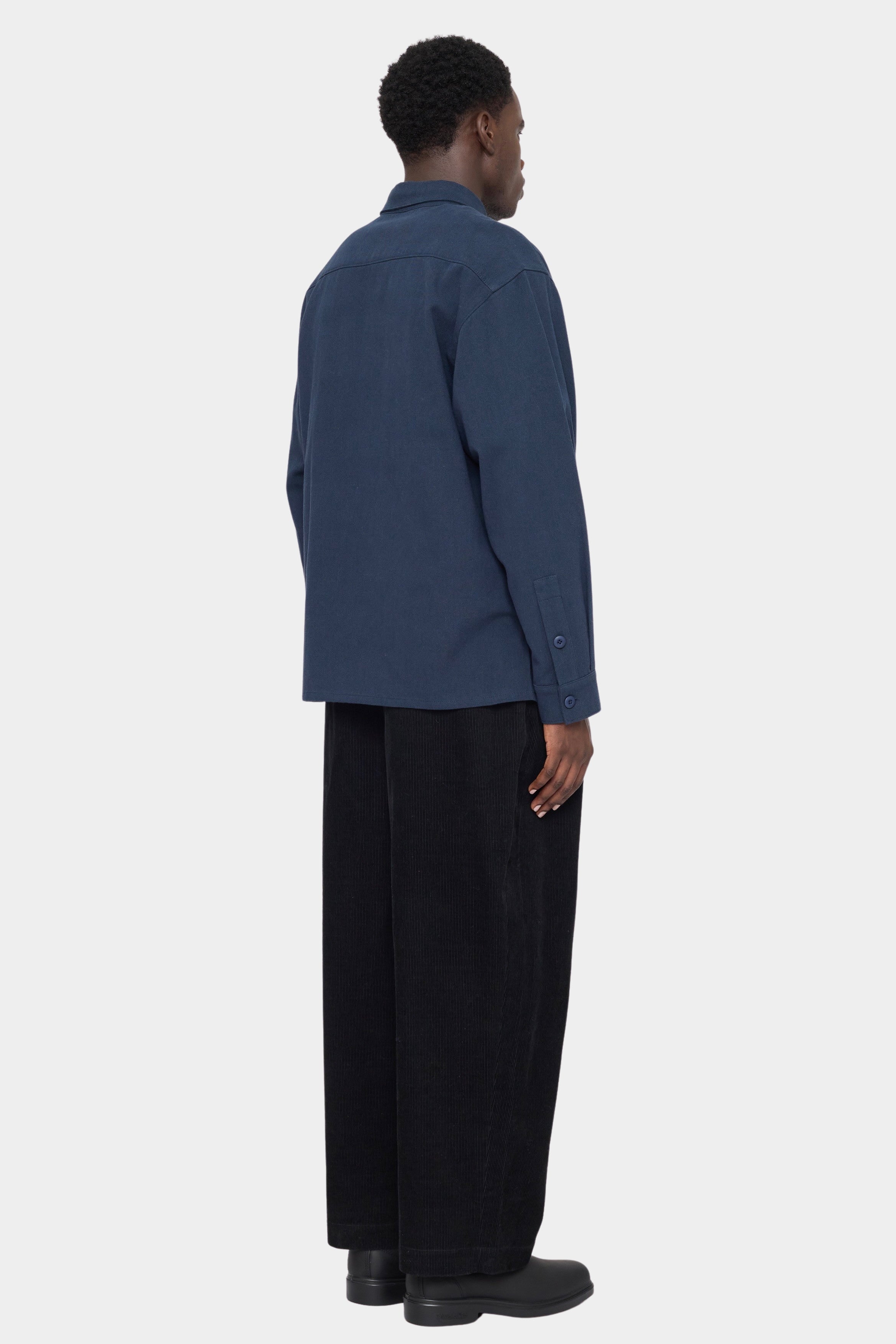 Back view of the navy Relaxed Pocket Shirt showing the dropped shoulders and straight hem