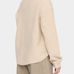 7115 by Szeki Signature Keepsake Jumper Off-White back detail with exposed sleeve seam.