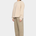 7115 by Szeki Signature Keepsake Jumper Off-White side view showing dropped shoulder and rounded hem.