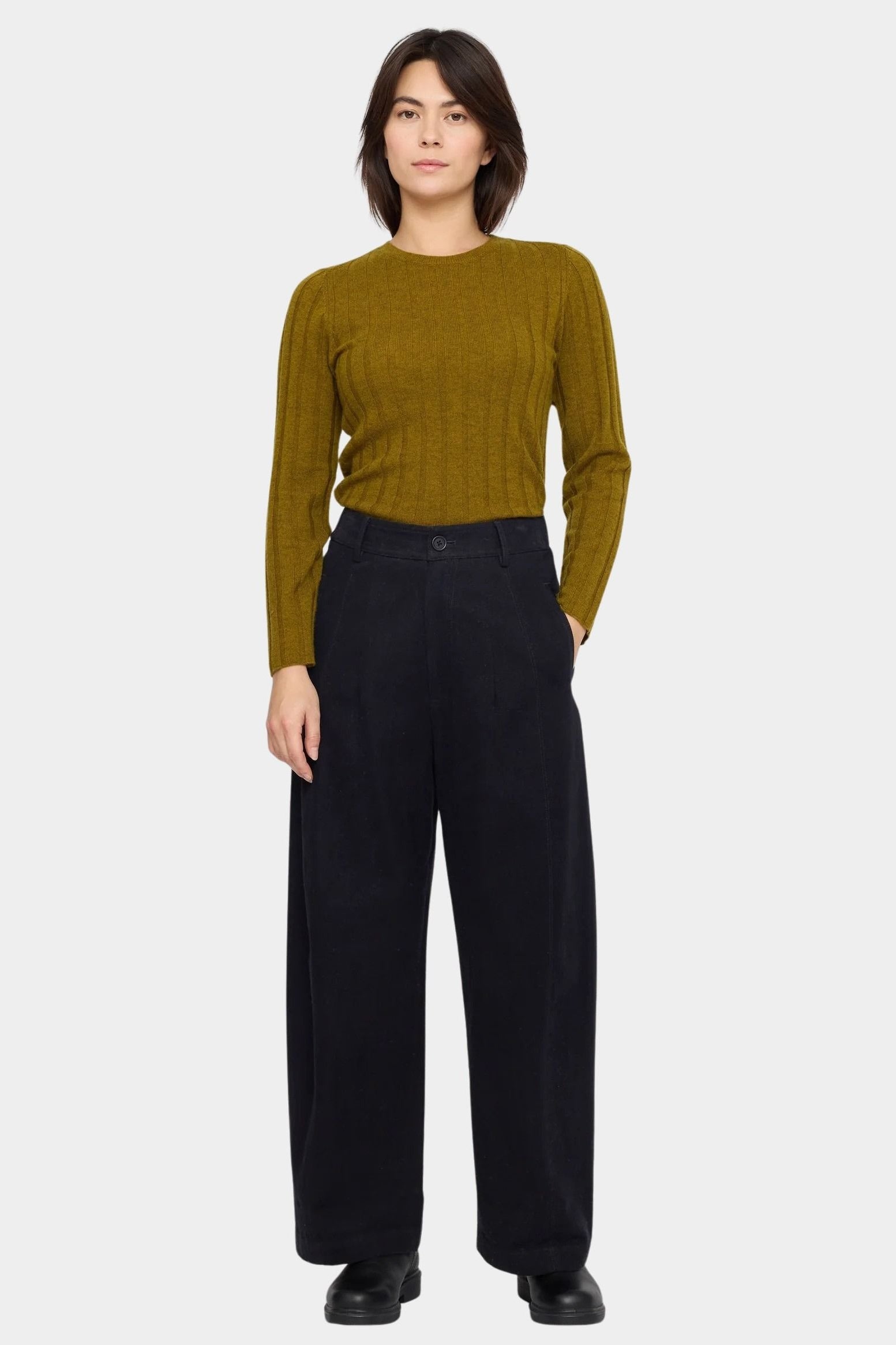 Front view of the 7115 by Szeki black straight legged trouser with a pleated waist and full length leg at YUCCA Denver