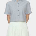 Close up front view of navy striped cropped shirt with short sleeves, pointed collar, and button front