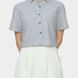 Close up front view of navy striped cropped shirt with short sleeves, pointed collar, and button front