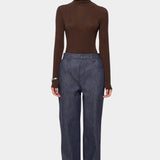 Amomento Turtle T-Shirt in Brown worn with wide-leg blue jeans, front view at YUCCA Denver