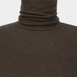 Three-quarter view of the Amomento Turtle T-Shirt in Brown, showing the fitted body and long sleeves