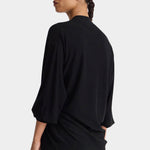 Apiece Apart Drippy Tissue Cardigan Black back view showing relaxed shape and fluid sleeves