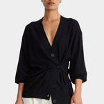 Apiece Apart Drippy Tissue Cardigan Black cinched at the waist with white trousers at YUCCA Denver