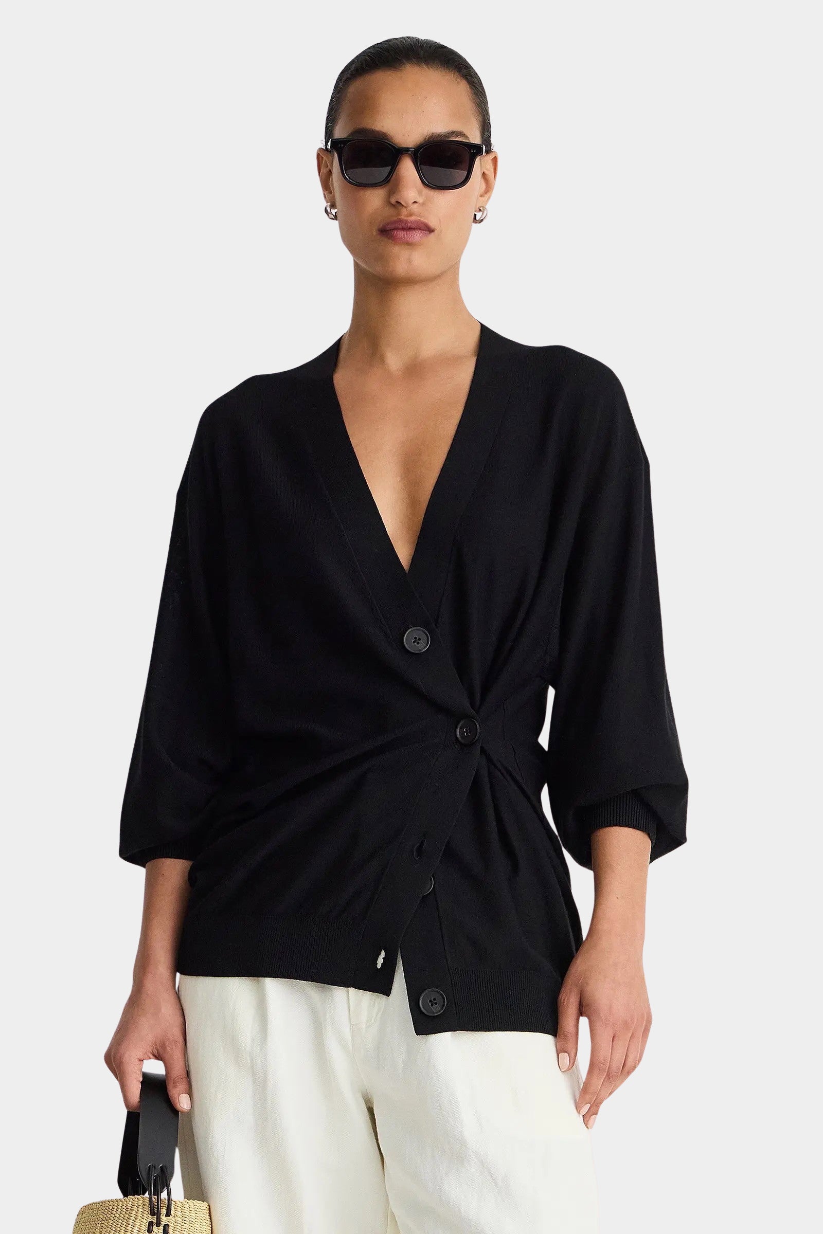 Apiece Apart Drippy Tissue Cardigan Black cinched at the waist with white trousers at YUCCA Denver