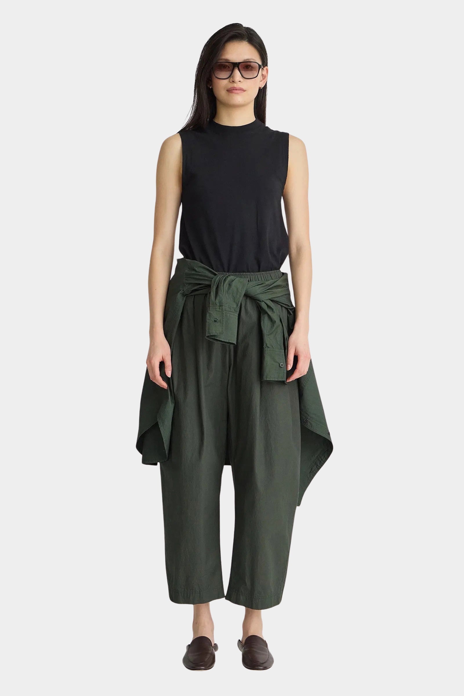 Apiece Apart Forte Tee Black sleeveless mock neck top styled with wide leg pants at YUCCA Denver