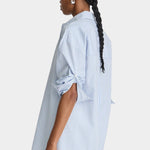 Apiece Apart Isolde Button Down Blue and White Stripes side profile with rolled sleeves and oversized fit