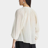 Back view of Apiece Apart Lo Campo Shirt Cream with gathered detailing and relaxed drape