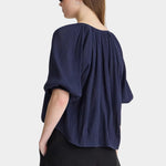 Back view of Apiece Apart Lo Campo Shirt Navy airy pullover blouse with gathered detailing and soft volume