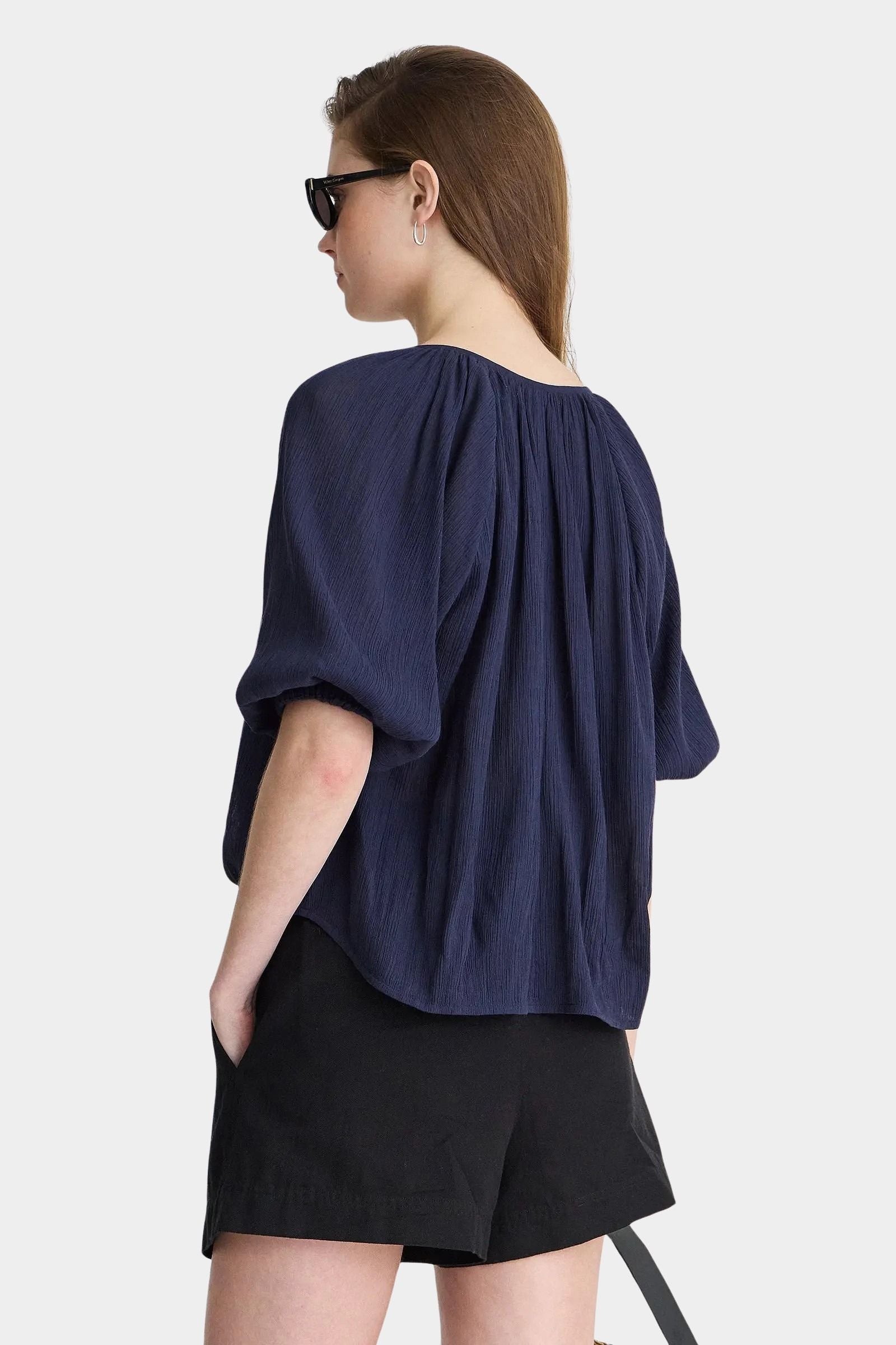 Back view of Apiece Apart Lo Campo Shirt Navy airy pullover blouse with gathered detailing and soft volume