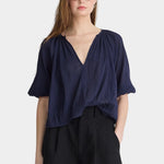 Front view of Apiece Apart Lo Campo Shirt Navy lightweight organic cotton top with puff sleeves